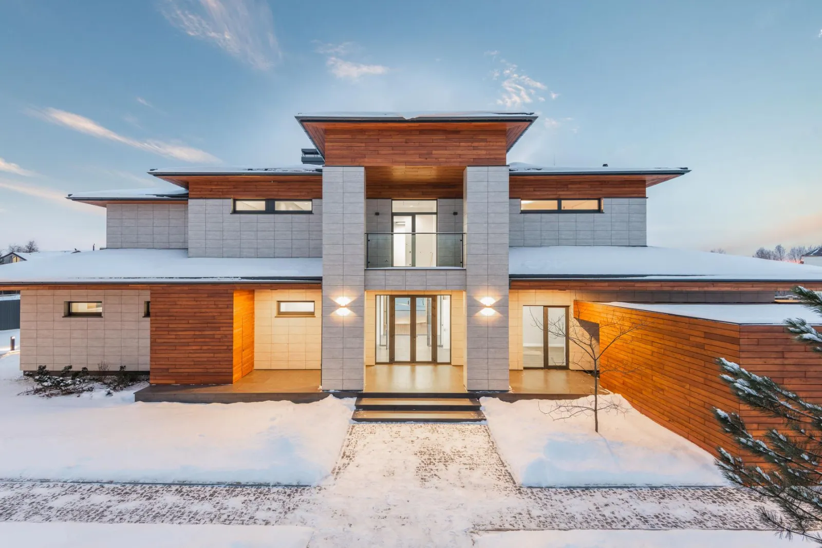 Finished modern two-storey house exterior with wood and stone accents